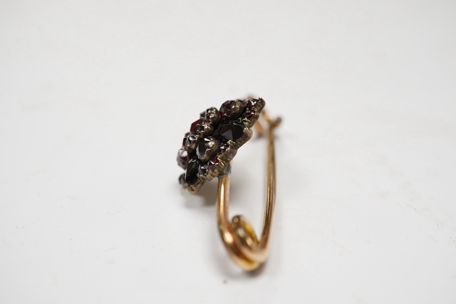 A rolled gold and garnet cluster set bar brooch, 44mm (adapted). Condition - poor to fair